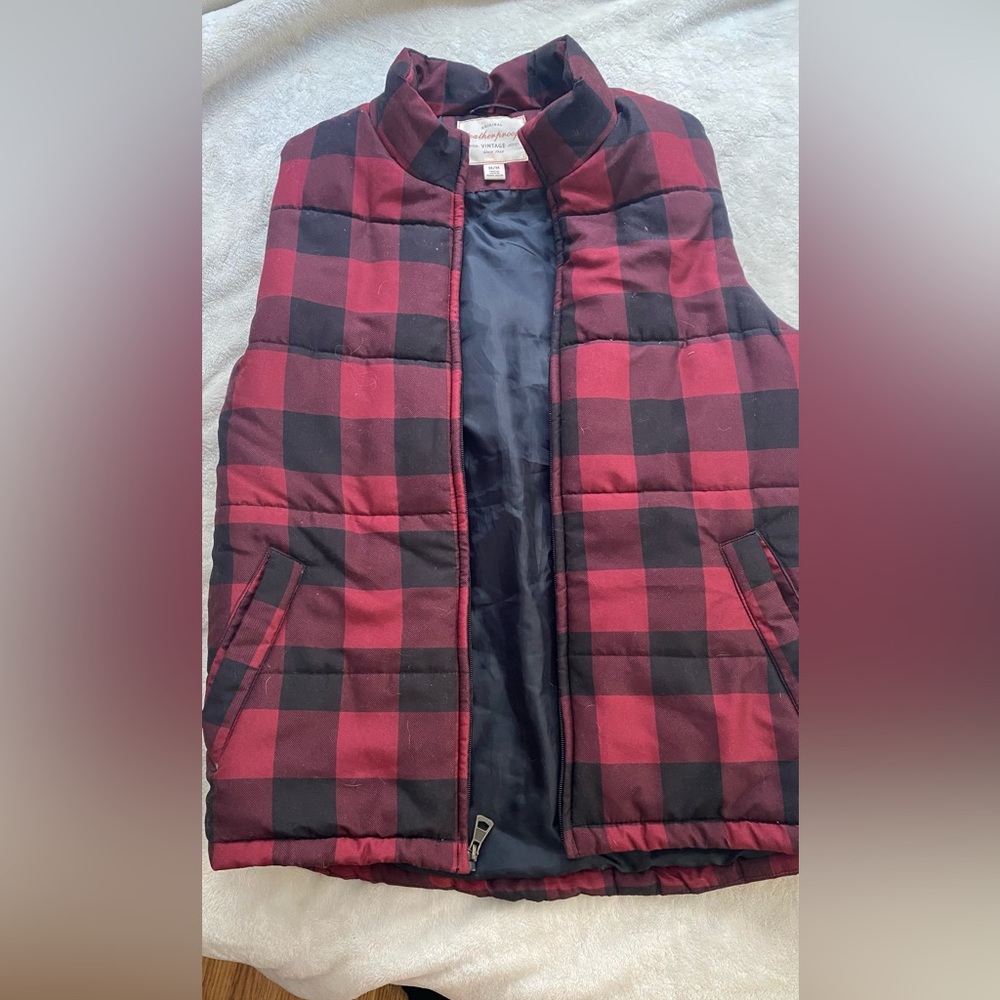Weatherproof insulated red and black checkered vest.